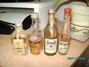 Four Miniature Bottles of Clear Spirits